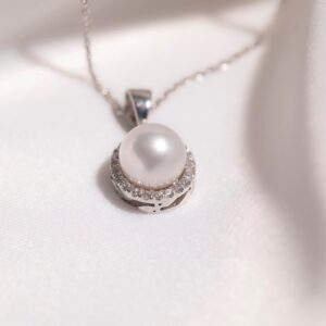 Dore Pearl and Diamond Pendant, White gold
